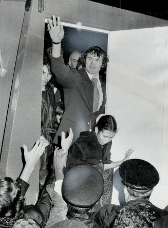 Paul Hendeson waves to well-wishers as he follows daughter Heather through doorway after Team Canada's return from Moscow. A reader suggests he has been underrated, deserves recognition