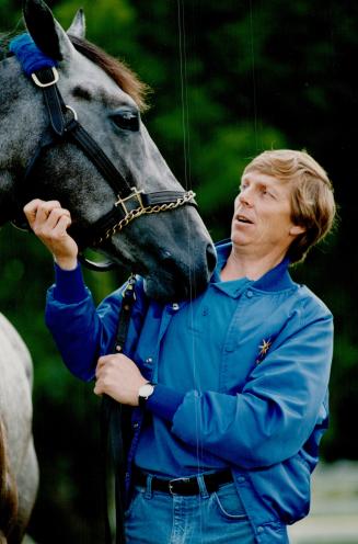 A lot at stakes. Benburb, favored in today's Breeders' Stakes at Woodbine, gives trainer Phil England a nudge yesterday. Meanwhile, Canadian filly Dance Smartly came up short yesterday in Chicago