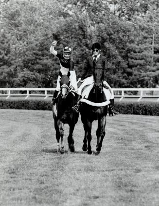Izzy Conquers the fort: Jockey Don Seymour whoops it up at Fort Erie after Izvestia won the Prince of Wales Stakes by 6 1/4 lengths yesterday