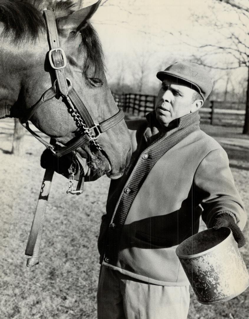 Never forgotten: Champion race horse and stallion Northern Dancer, with groom Harvey Green in 1964, was buried early yesterday at Windfields Farm near Oshawa, where he was born 29 years ago