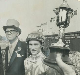 Prized queen's plate is proudly displayed by Art Stollery, breeder of winner Kennedy Road which is owned by his wife, and Sandy Hawley, who rode colt (...)