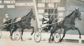 Some kind of a gift. Glen Garnsey, head trainer and driver of Castletown Farm, reins Noble Florie (No. 3) to victory over Speeding Evening, (No. 8) in(...)