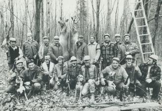 Group of hunters with trophies