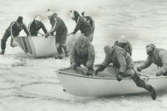 In a scramble over the ice, The Argonaut Rowing Club team, right, is challenged by a determined Pier 4 crew
