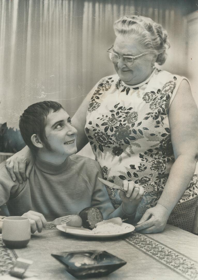 One of the family: Mrs. Katharine Engel looks fondly at jockey Marty Gibson. He calls her Mom, having lost his own mother when he was 14 years of age.(...)