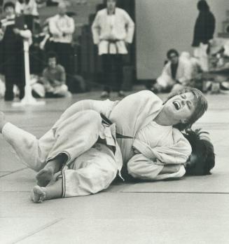 Joy of victory. Ohio's Betty Stann enjoys the upper hand in bout with Michelle Leclerc in Ontario Open International judo championships yesterday. Stann placed second in open class