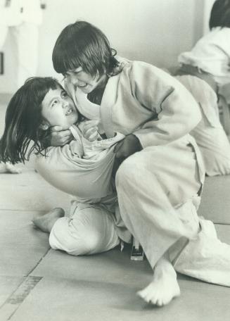 Junior Judokas. If facial expressions can tell you anything, then these two young ladies are giving it all they have in a workout at the Hatashita Jud(...)