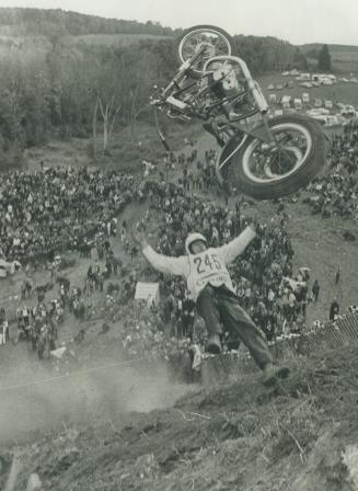 And Away he Goes. Jim Orosz of Port Colborne flies through the air, but not with greatest of ease, as he and his motorcycle tumble down hill near the (...)