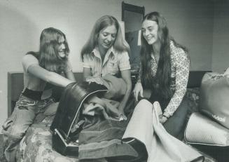 Packing for trip to Europe, to compete in dual meets against West Germany and Netherlands prior to Munich Olympics, are three members of women's track(...)