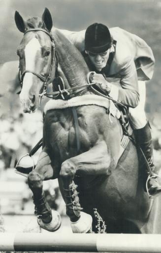 First French Canadian to ride for his country in Olympics, Michel Vaillancourt guides Branch Couny to silver medal in jump-off
