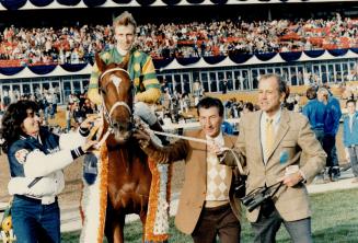 Jockey - Jean- Luc Samyn, Horse - Nassipour Winner 1985 Rothman's International and Trainer - Stephen Dimauro, Owner - Cothran Camppell (far right)
