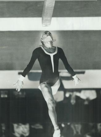 Little Karen shows her stuff. Karen Kelsall of Vancouver, who at 13 is the youngest member of Canada's Olympic gymnastics team, shows fine form in thi(...)