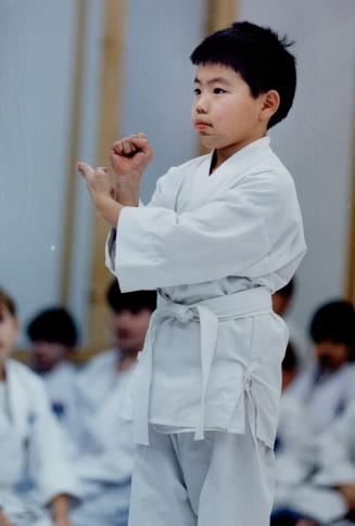 Blocked: Wilson Fung, 10, performs a shuto-uke, or knife-hand block, in a karate class