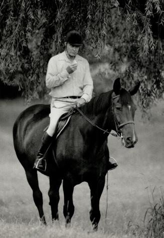 Must eat: Active equestrian and diabetic Jack Murdock, 62, of Uxbridge is shown eating a regularly scheduled meal during a ride on one of his horses