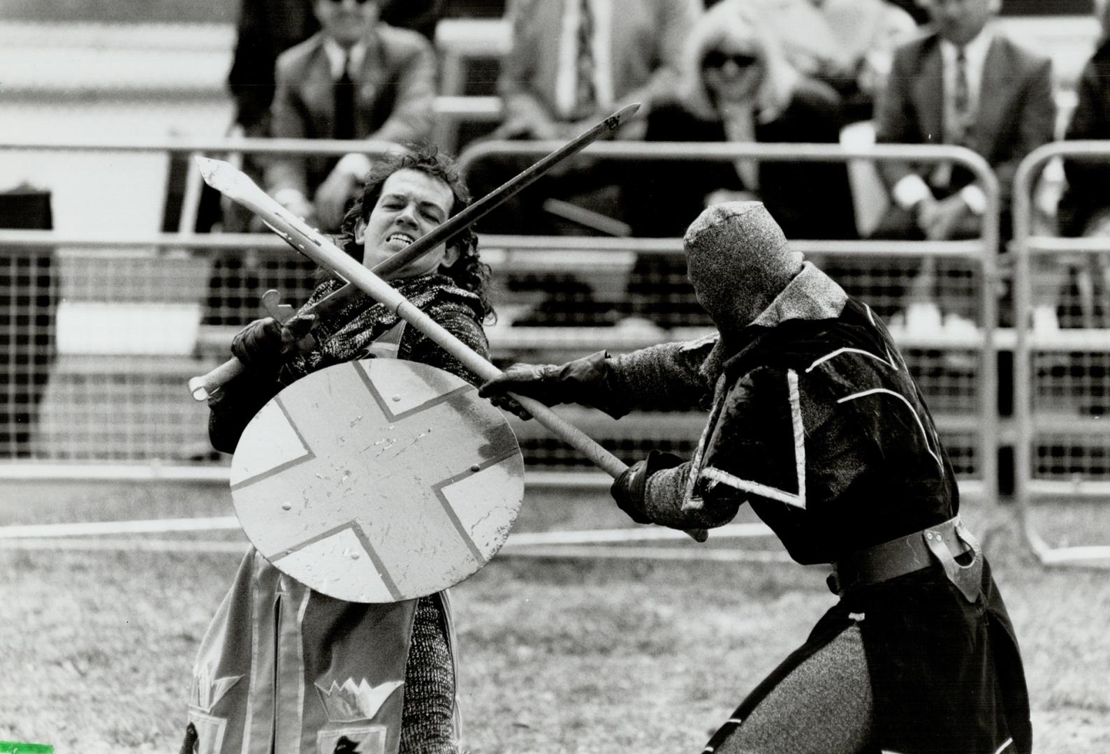 Let the games begin: Metro area politicians watch as two knights show off their prowess at a groundbreaking ceremony yesterday for a Spanish castle at the CNE's Arts Crafts Hobbies Building