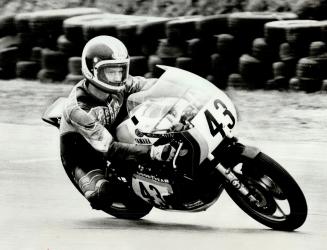 All alone and feeling great. Mike Baldwin of U.S., at top, shocked competition when he won Motorcycle Grand Prix of Canada yesterday at Mosport Park. (...)
