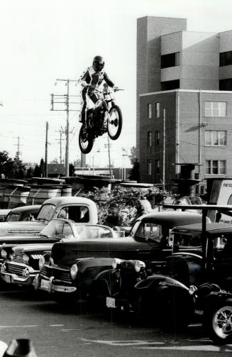 Ronnie Hawkins, look out! Mississauga daredevil Larry Hurricane McLean, 28, took his motorcycle over seven antique cars - entertainer Hawkins was in o(...)