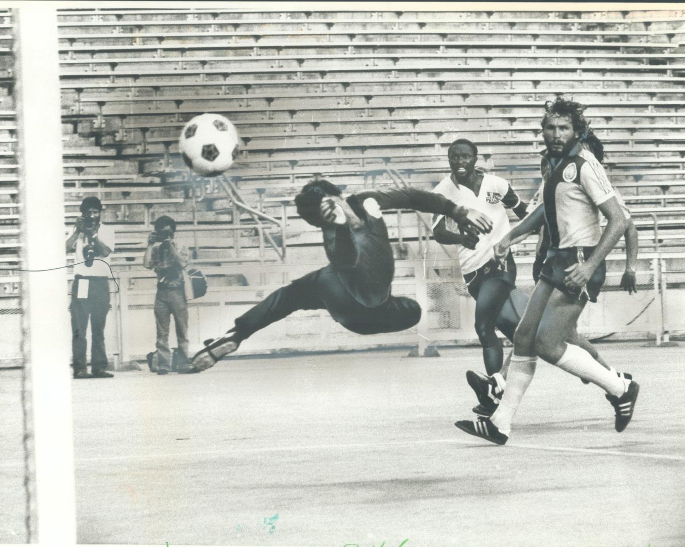 Jomo Sono scores against New England's Kevin Keenan during last season's North American Soccer League action