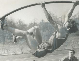 On His Way to a record. Don Henwood of Woburn Collegiate starts off in junior pole vault event. He reached a height of 13 feet, 9 inches to better for(...)