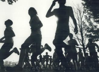 Me and my shadows at high park, Outlined against the autumn sky, these leaders of the pack are off and running in the City of Toronto midget boys' hig(...)