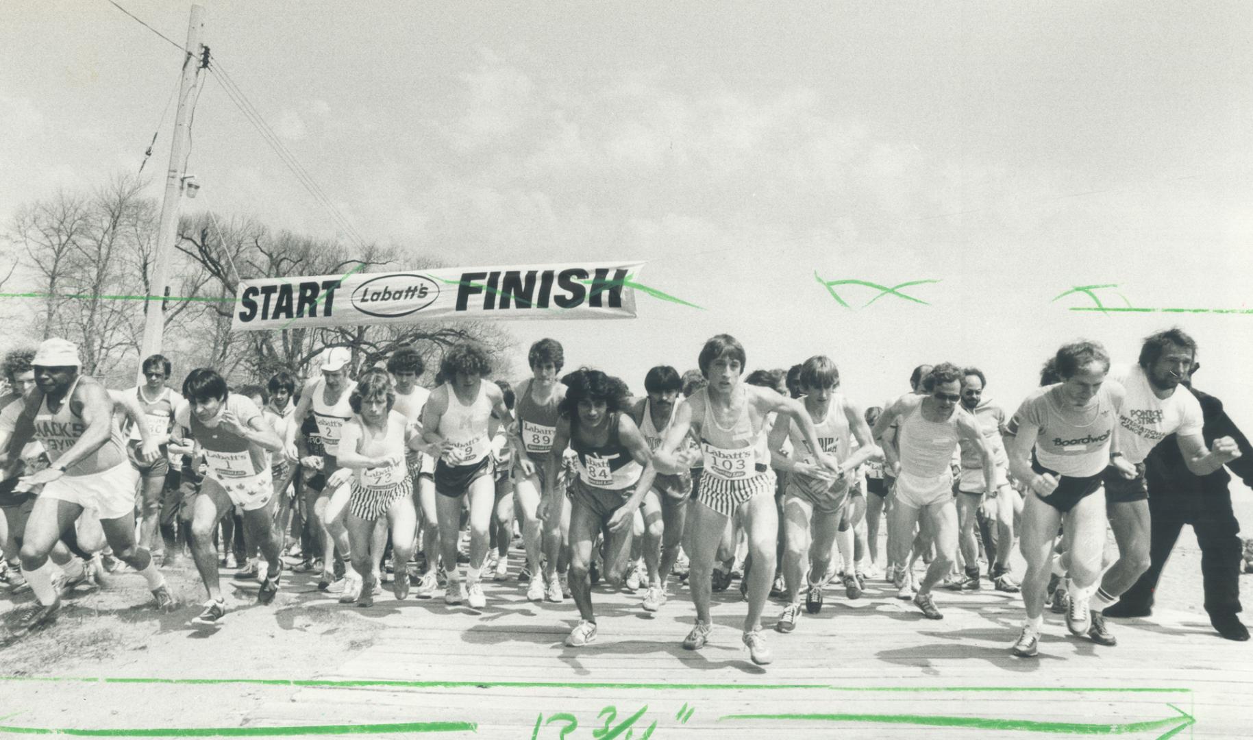 They're off, Approximately 350 pairs of running shoes - all sizes and colors - pounded down the boardwalk yesterday in the second annual Beaches Board(...)