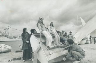 They're getting a new slant on sailing, Instructor Bill Wakeline shows Kim Llewellyn, 14, and Karen Thacker, 14, how a boat heels over in the wind dur(...)