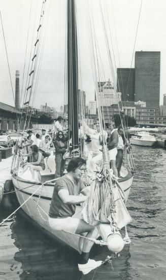 Crew on the schooner wild harp prepare for days sail, Most are novices who have joined the Schooner Club to relax, make friends