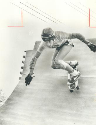 Scarborough Skateboarder shows his skill on ramp at Markham Rd