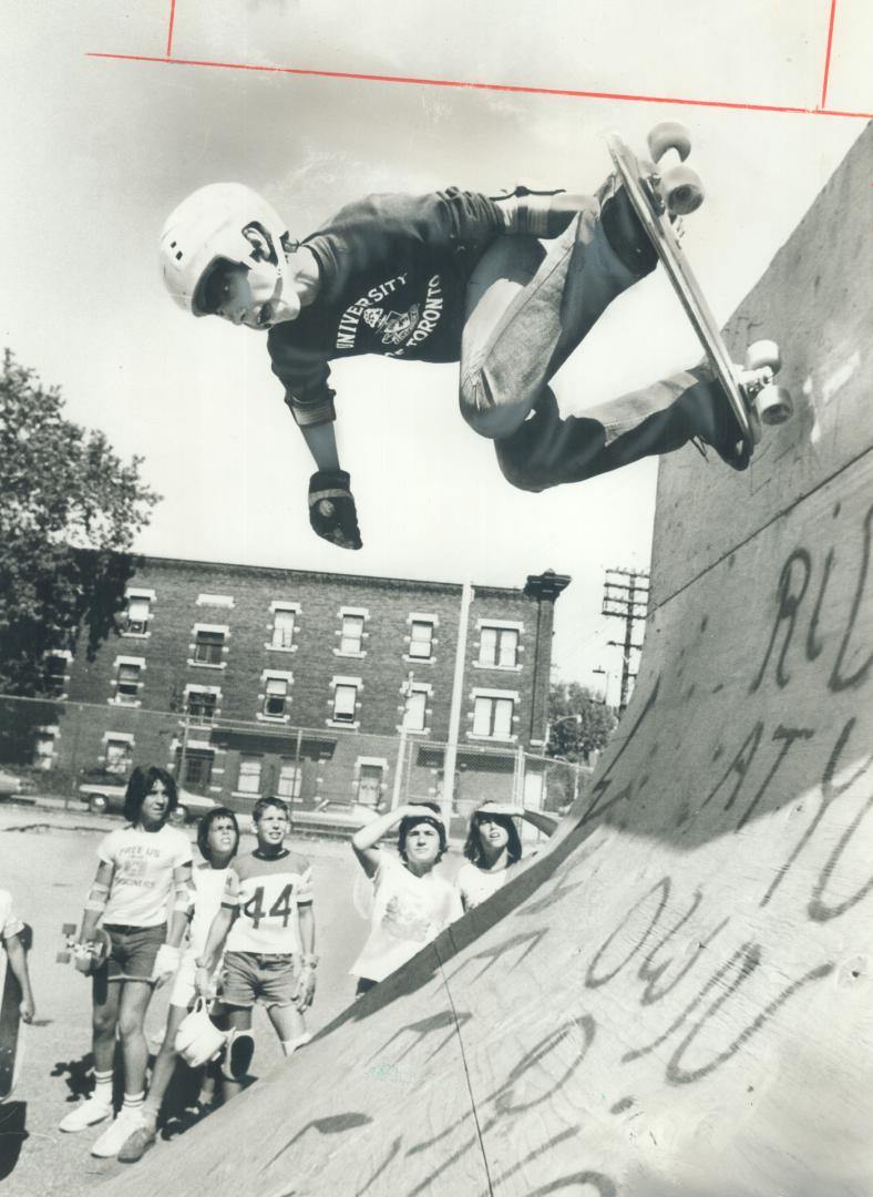 Wheelers Want to Deal, Luis Sousa, 16, demonstrates the home-made ramp at St