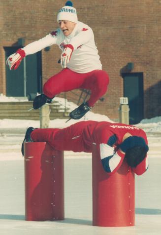 Barrelling over a trusting friend, World champion skating jumper Yvon Jolien sails over Guy Boudreault at Harbourfront's Winterfest '87 yesterday. The(...)