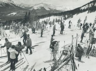 High in the Rockles in the Lake Louise area, a group of skiers prepare for an exhilarating day on the trails