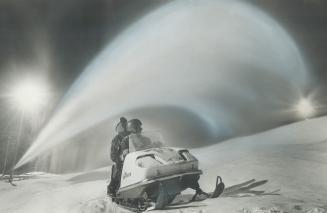 Giving mother nature a helping hand, Making artificial snow, professional snowmakers John Hockridge and Pete Wildhagen ride snowmobile from one snow c(...)