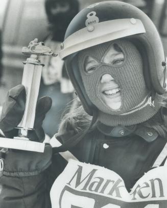 The winner of the race for women driving snowmobiles with 300-cc engines in the Richmond Hill Kinsmen Club races yesterday, 13-year-old Jackie Cook, s(...)