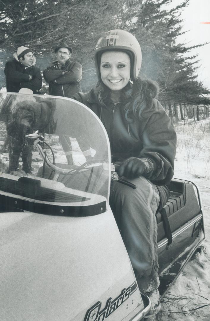 Norma Dudyk, Miss Argentina, rides snowmobile at the Chinguacousy Club's Family Day