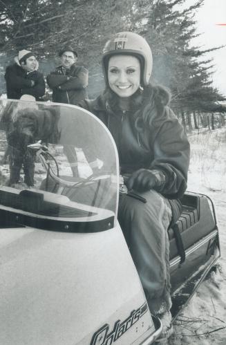 Norma Dudyk, Miss Argentina, rides snowmobile at the Chinguacousy Club's Family Day