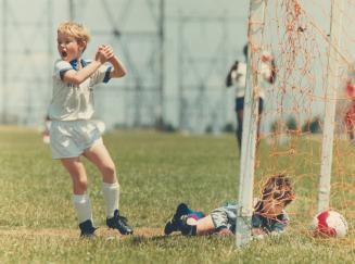 Hey mom, how about that?, Scarborough Blizzard's Danley Johnson celebrates after scoring against the North York Cosmos goalie Chris Polizos in Robbie (...)
