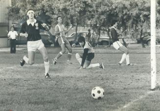 Near miss, Goaltender Dominic Macina of (kneeling) and Peter Gacser (left) of Wexford watch as ball misses net during match against the Shimuzu team f(...)