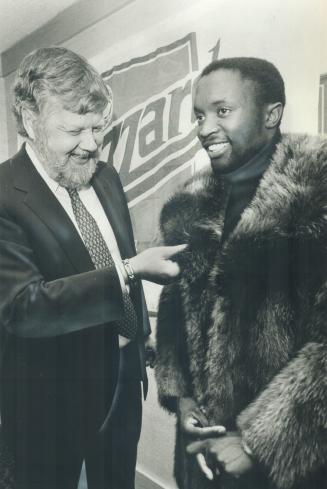 Happy twosome: Blizzard president Clive Toye, left, admires coat given to star player Jomo Sono as a bonus for his agreeing to three year contract with the North American Soccer League team