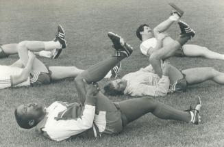 Ouch! That hurts. South African Jomo Sono grimaces as he goes through calisthenics at Blizzard camp
