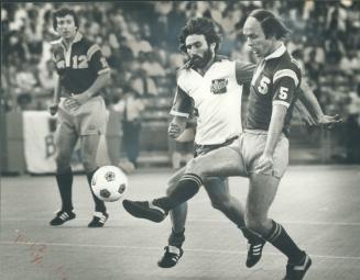 Getting his kicks, John Dempsey (5) of Philadelphia Fury battles Blizzard's George Gibbs for control of the ball