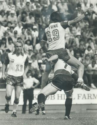 Byrne's riding high: Blizzard striker David Byrne went up as high as he possibly could with the aid of Minnesota Strikers' Ken Fogarthy as he tried to connect on a cross pass yesterday