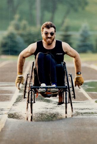 Drive to succeed takes its toll on 'wheelie', Gino Vendetti goes through the laps at Birchmount Stadium in preparation for this week's Ontario Games f(...)