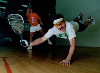Back in the swing: Mississauga chiropractor Ron Burns lunges for a return on a shot by his opponent, York firefighter Jim Duffney, at the Airport Racquetball Club