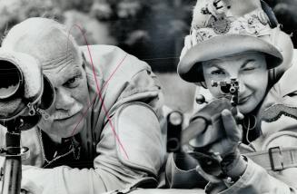 Edith Vamplew Poised With Rifle, Toronto mother of two enters shooting competitions