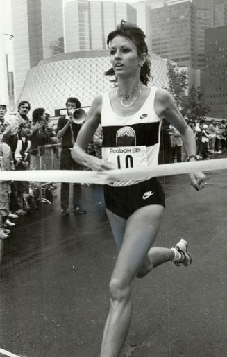 Aussie triumph: Lisa Martin of Australia crosses the finish line to win the women's division of the Toronto International 10km