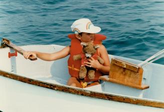 Nautical bear: Below, Simone Rodrigue, 7, takes her teddy bear for a ride