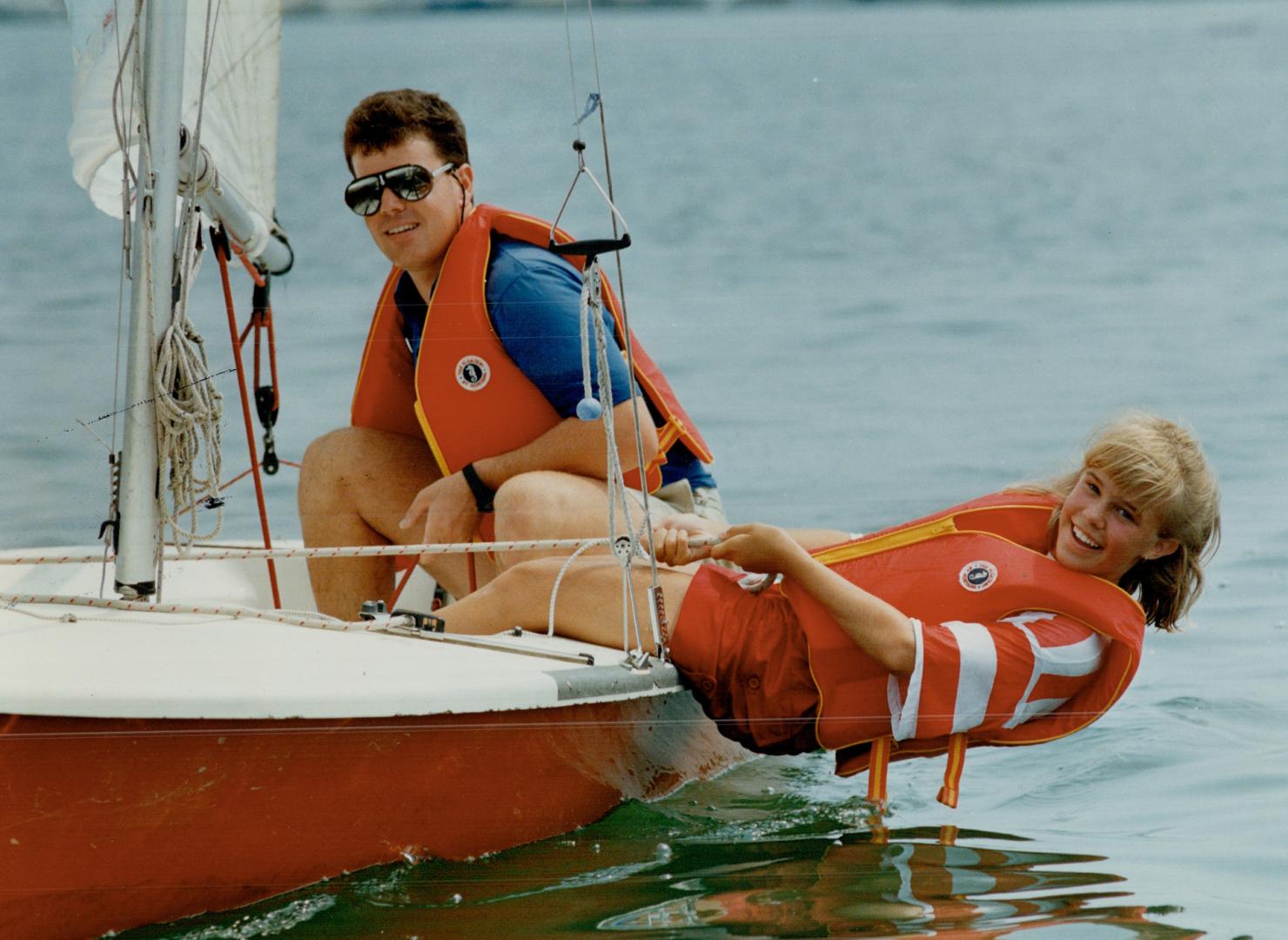Scoot Hughes, instructor at Humber College School of Sailing, watches as Jennifer Marshall executes a hiking out manoeuvre in a Laser 11 dinghy. One t(...)