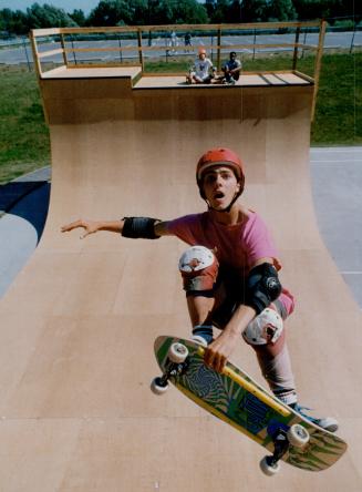 Up and at'em in Oshawa, Rob Davies, 17, is getting every foot and more out of the 15-foot high intermediate pipe at a new skateboard park in Oshawa. T(...)
