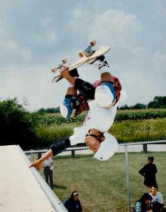 Defying gravity, Pastor Deleon, who skateboards for Welches Wild Ones, gets an upside-down view of Richmond Hill's skateboard park at Bond Lake Arena.(...)