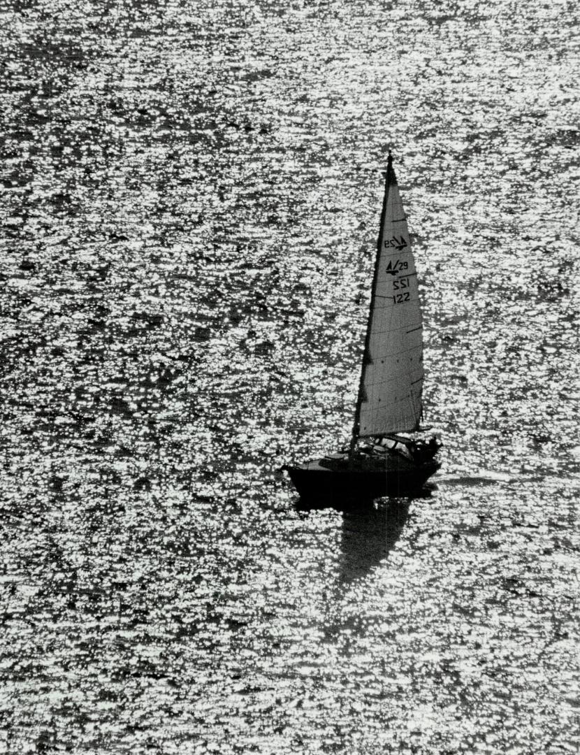 Fall sail, A sailboat slices through the water on Lake Ontario yesterday under a crisp, sunny autumn sky